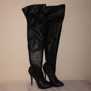 ZiGiny thigh high black boots.